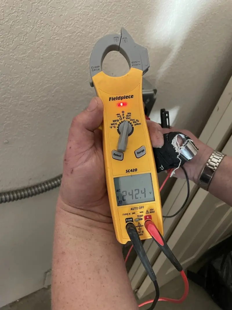 Voltage testing with clamp meter during Recessed Lighting Installation in Syracuse